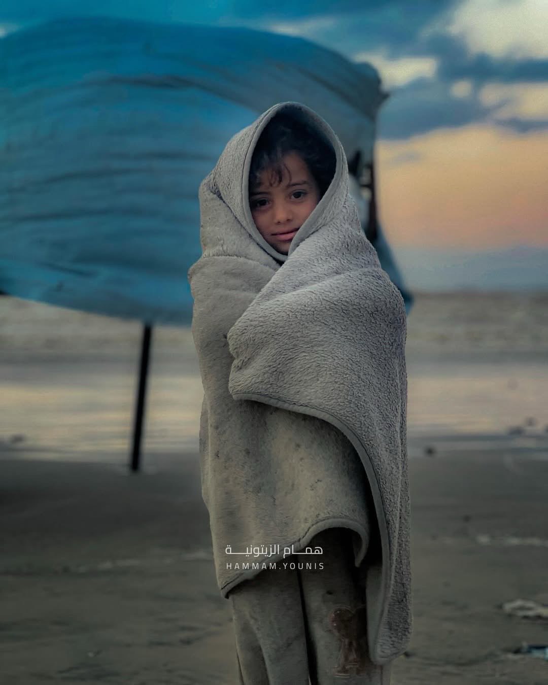 Little girl endures winter cold in tent without adequate shelter