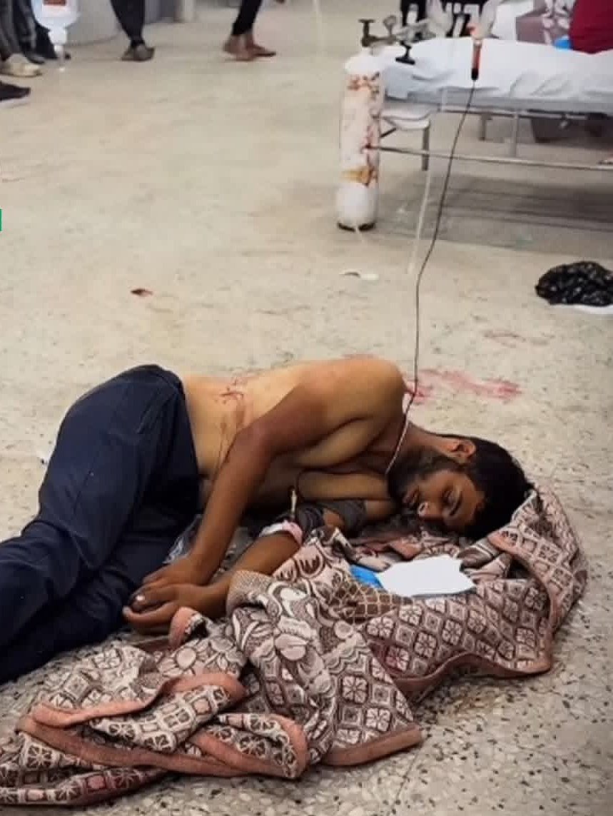 Wounded youth lies on Gaza hospital floor amid medical supply shortage