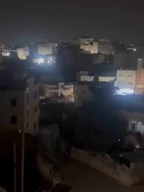 Israeli forces raid Yatta City, arrest dozens of Palestinians