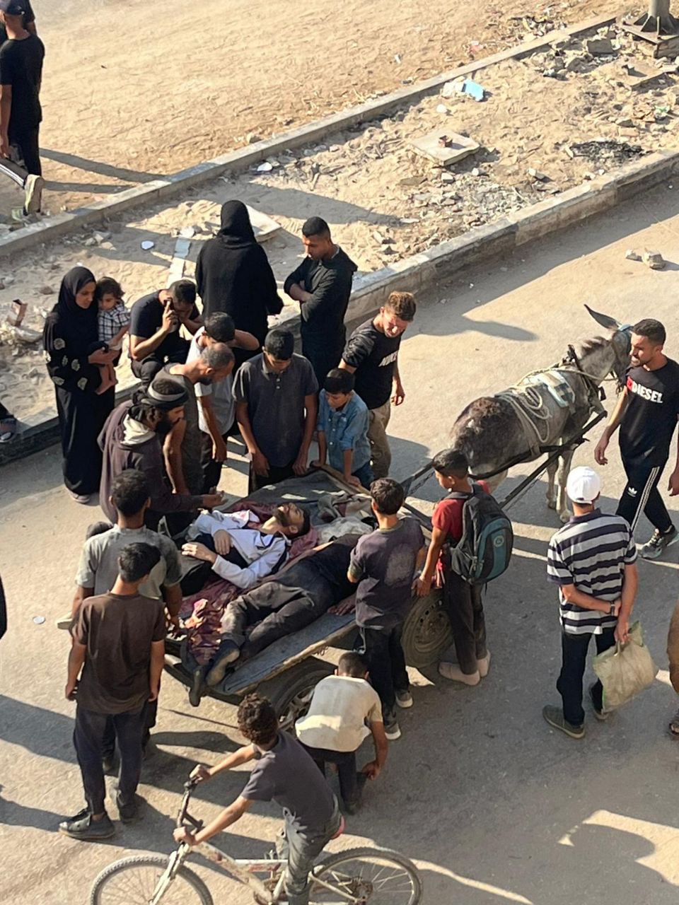 Wounded transported near aid distribution center daily