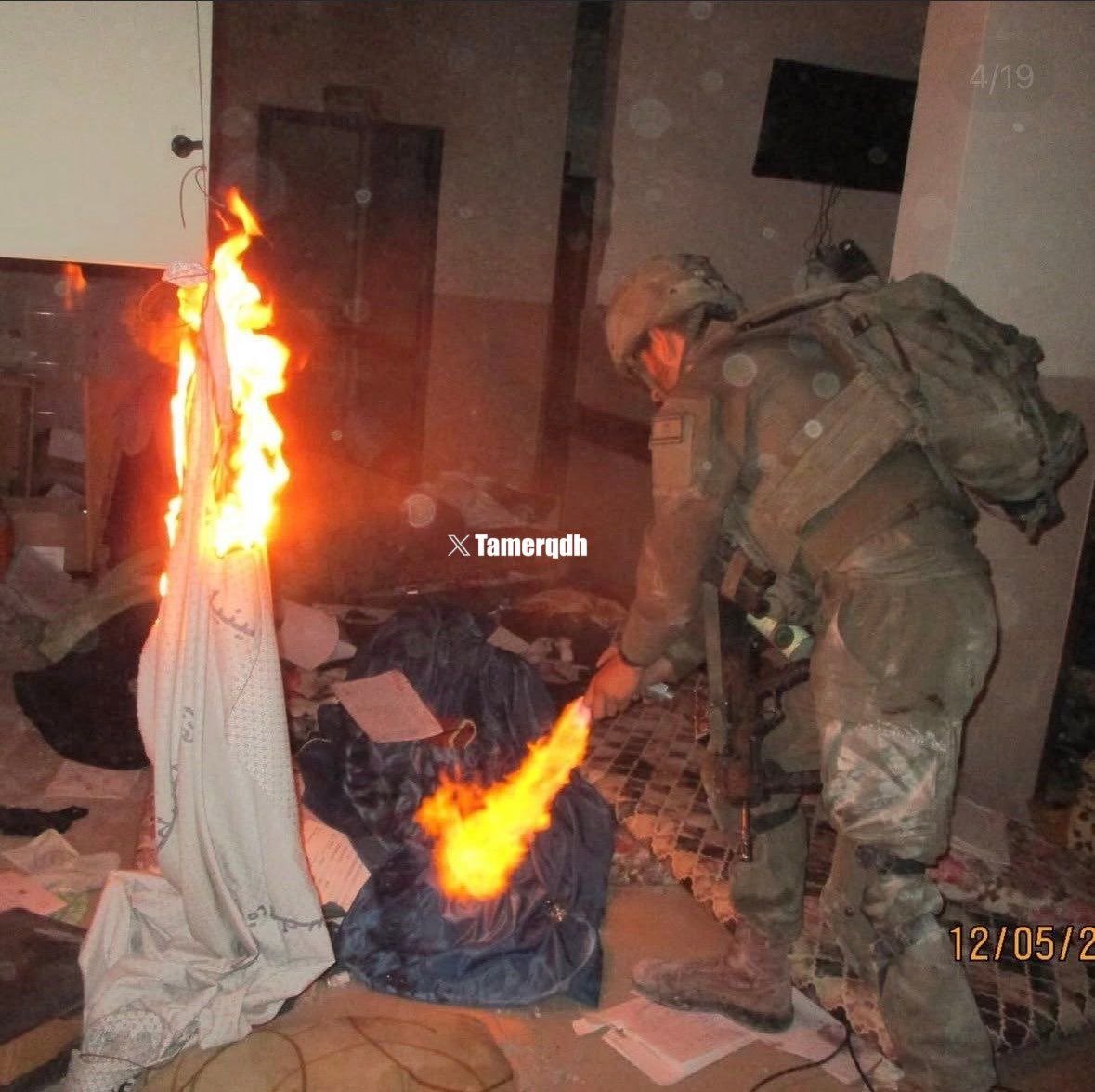 Israeli soldier setting Palestinian house fire in Gaza
