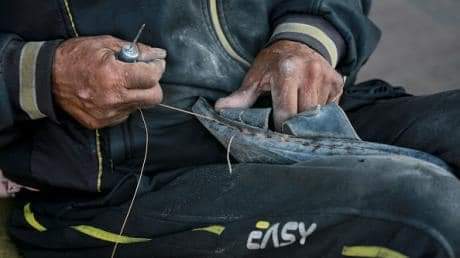 Exhausted feet on Gaza ruins – photograph by Bashar Ahmed Taleb