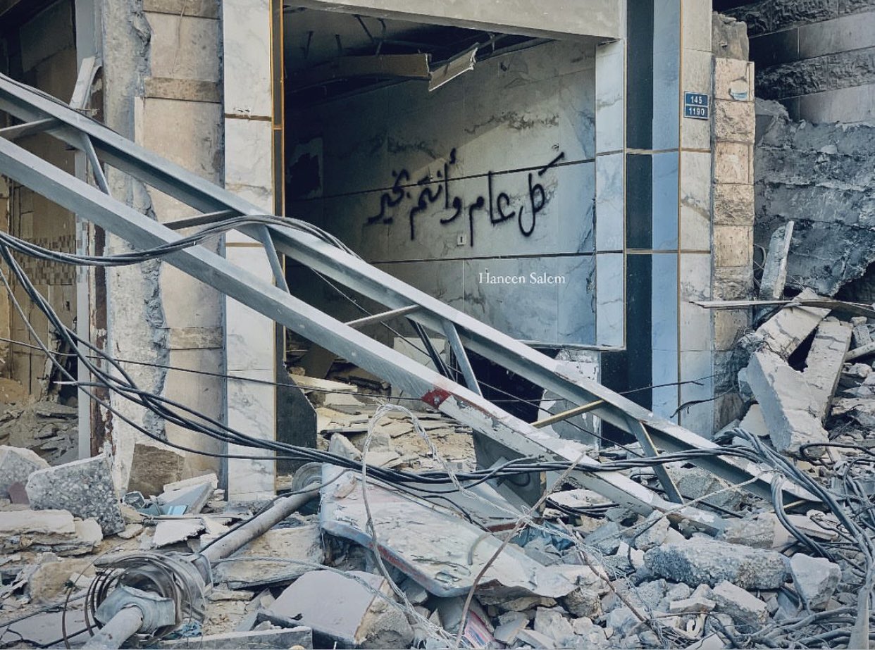 Young man writes Eid Mubarak for family under rubble
