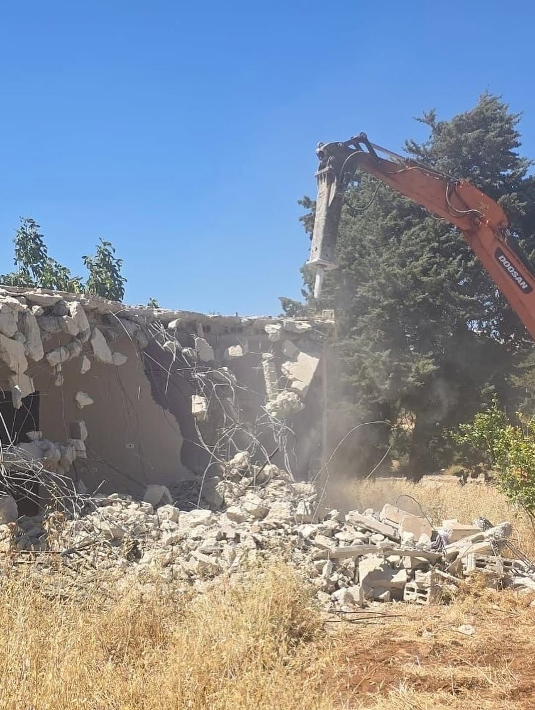 Israeli occupation forces Palestinian to demolish his own home in Qalandiya