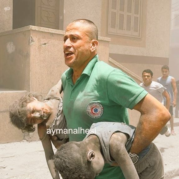 Paramedic carries children bodies after Israeli bombing Gaza