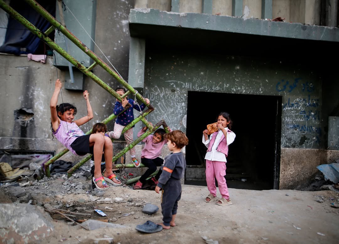 Children Build Swing on Islamic University Ruins in Gaza