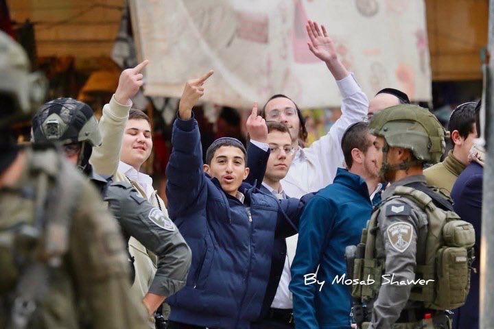 Settlers in Hebron Old City under Israeli occupation protection