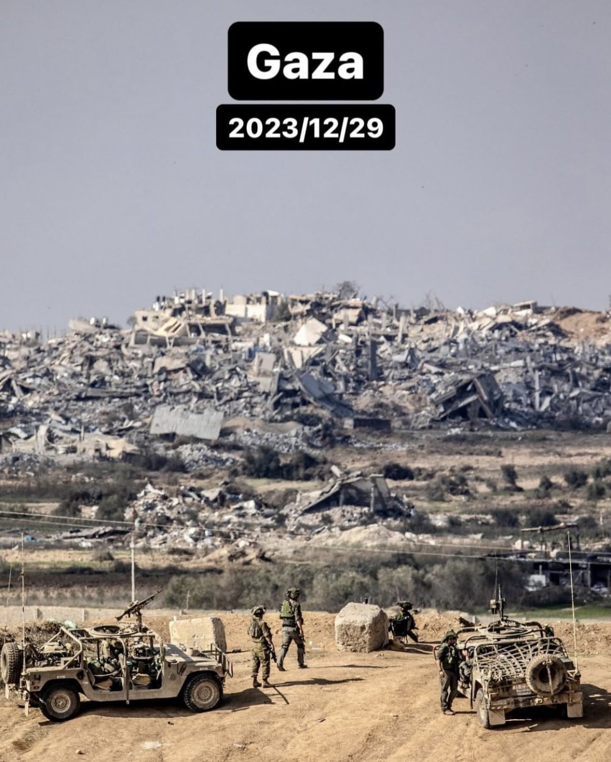 Gaza devastation viewed from other side of barbed fence
