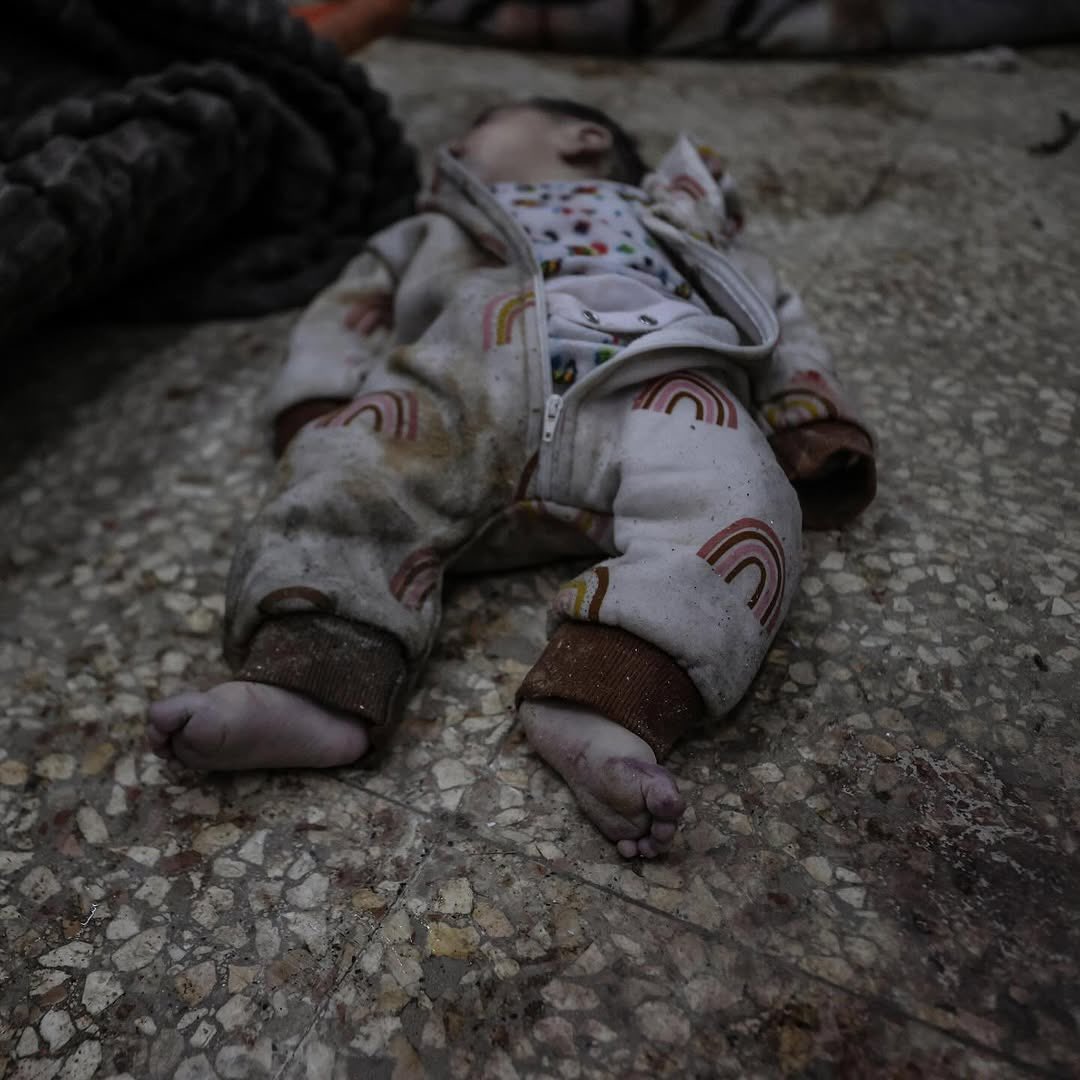 Infant killed in Israeli airstrike arrives at Gaza hospital
