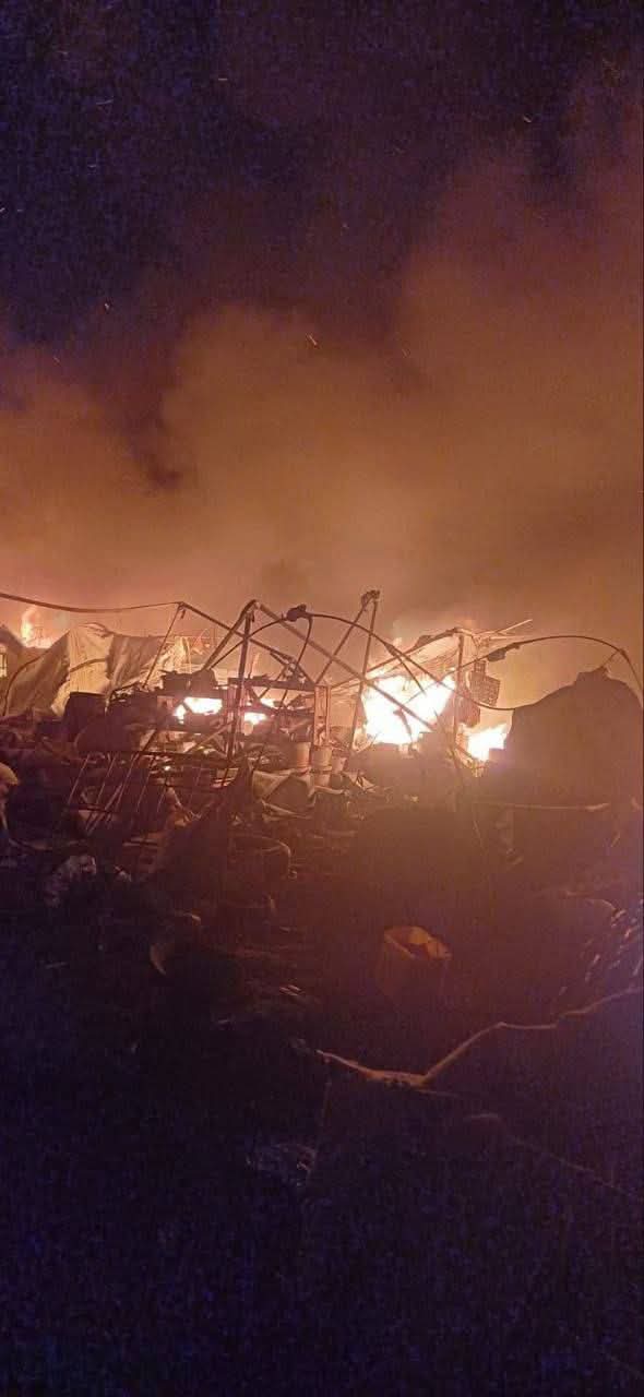 Tents burning with displaced people inside in Al-Mawasi