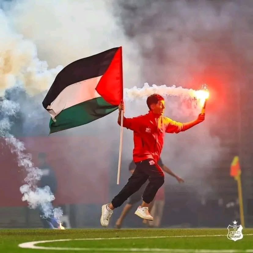 Fan Displays Palestinian Flag at Al Ahly Benghazi Match
