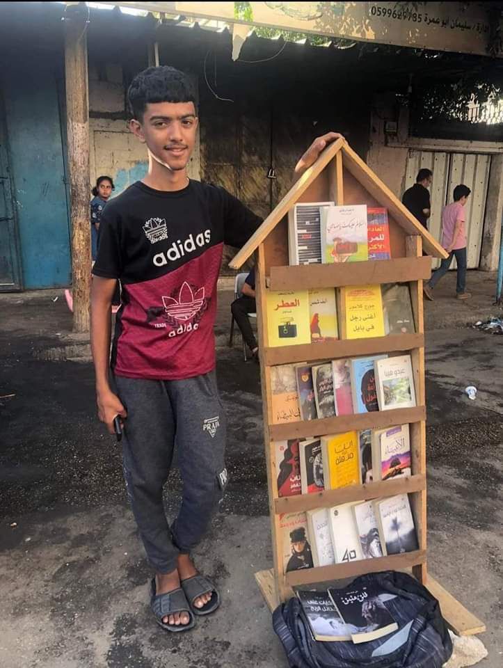 Displaced Palestinian Boy Sells Books in Deir el-Balah