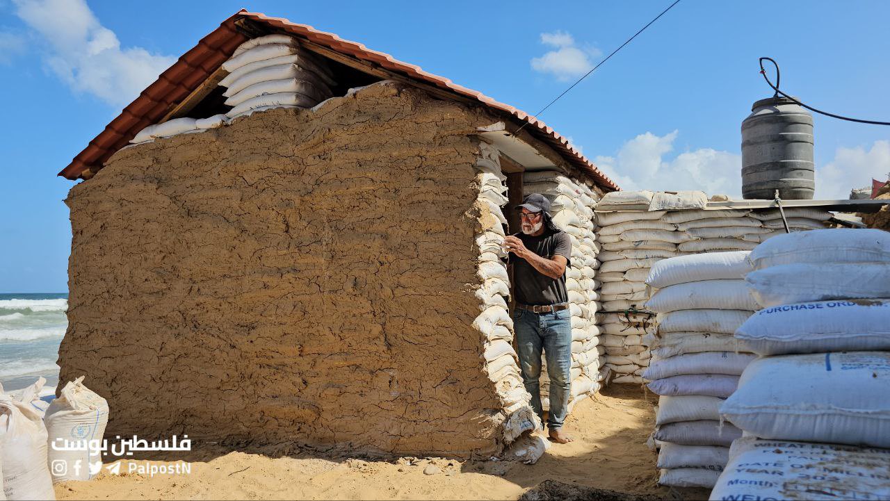 Palestinian man builds shelter from sacks and mud in Gaza
