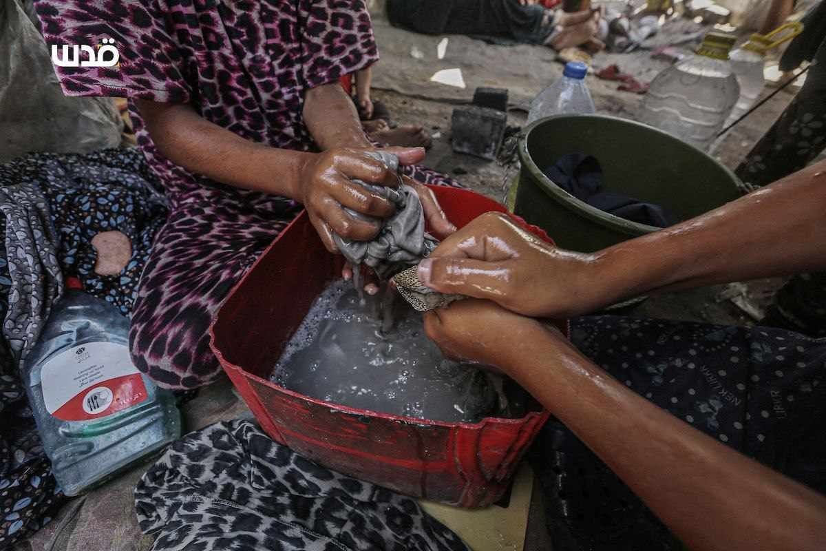 Gaza soap vendor produces liquid soap manually amid blockade
