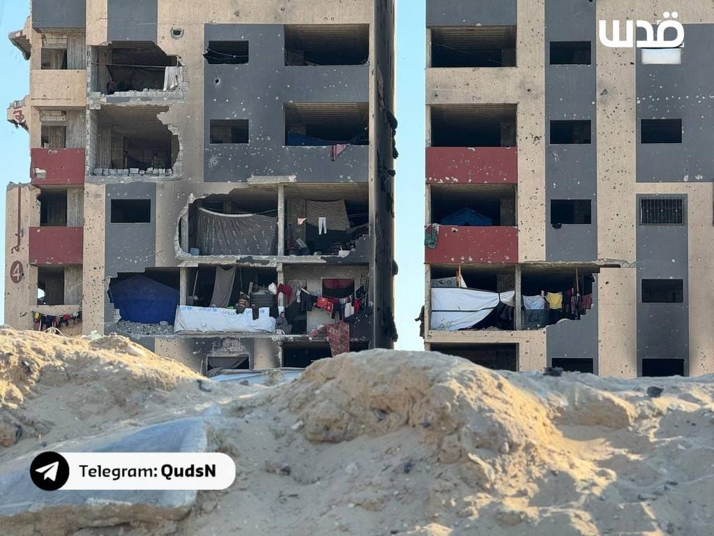 Displaced Palestinians shelter in damaged apartments after Khan Yunis bombardment