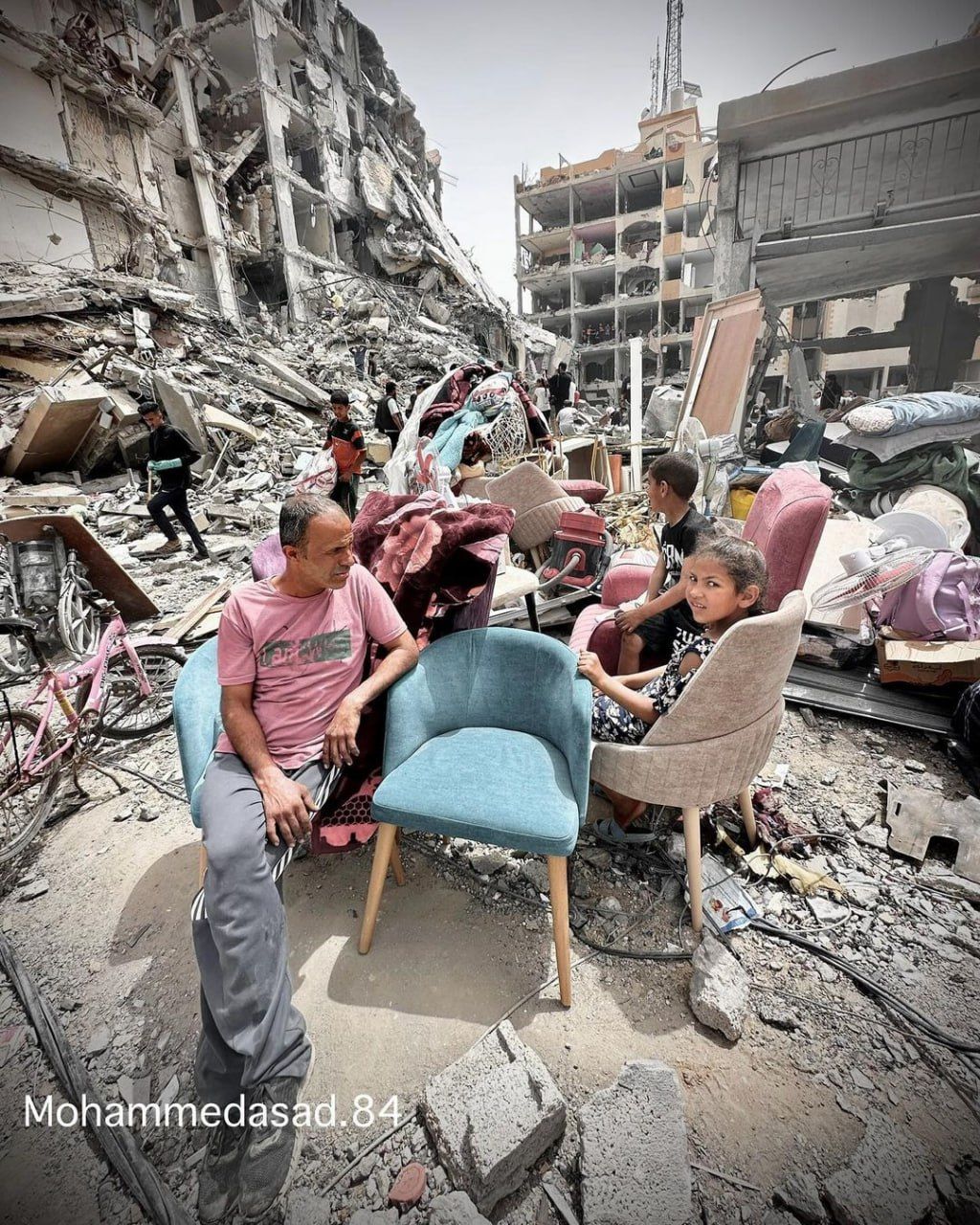 Palestinians amid rubble of destroyed homes in Nuseirat camp