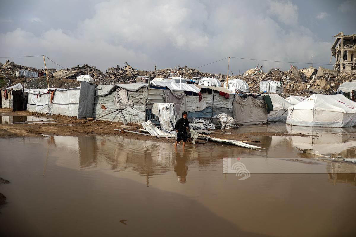 Rainwater floods displaced families’ tents in Gaza City
