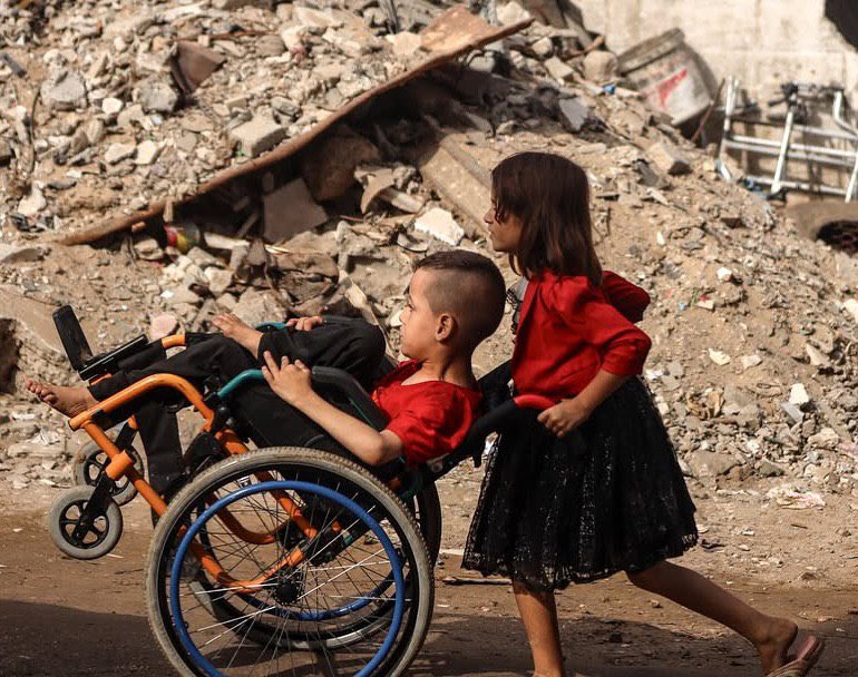 Palestinian Girl Assists Disabled Brother in Gaza City