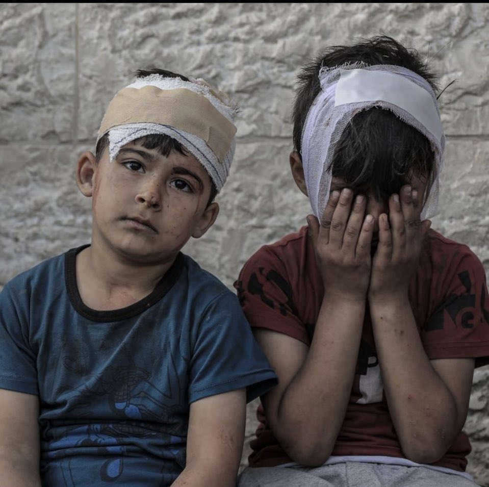 Palestinian Children Identify Family Members After Israeli Bombardment