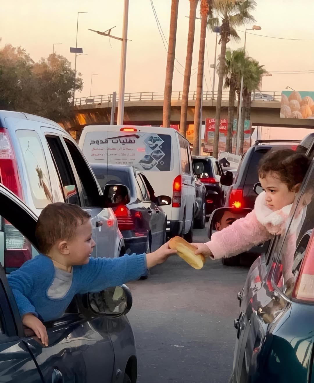 Lebanese Children Share Bread During Displacement