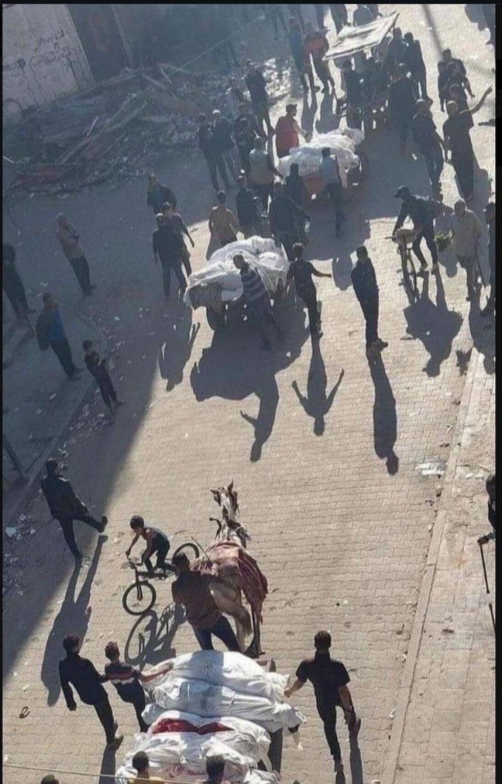 Palestinians Transport Bodies After Israeli Air Strikes in Gaza