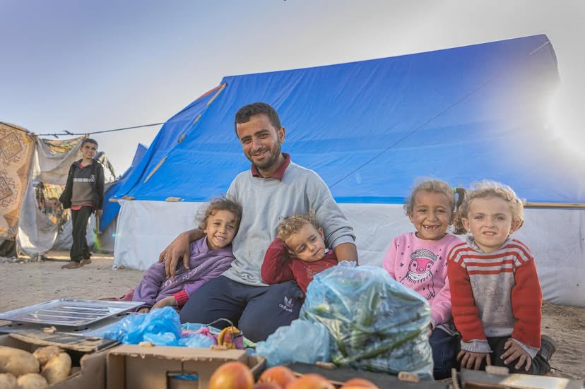 Displaced Palestinian Ahmad sells vegetables to support his family in Rafah
