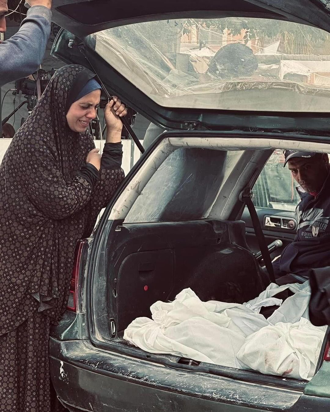 Palestinian woman bids farewell to brother and cousin killed in Gaza