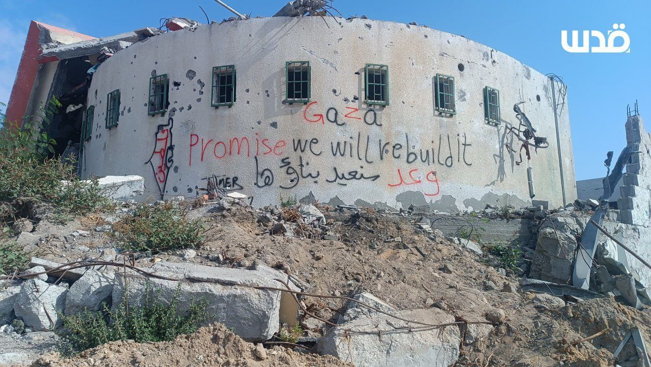 Palestinians spray messages of resilience on destroyed homes in Gaza