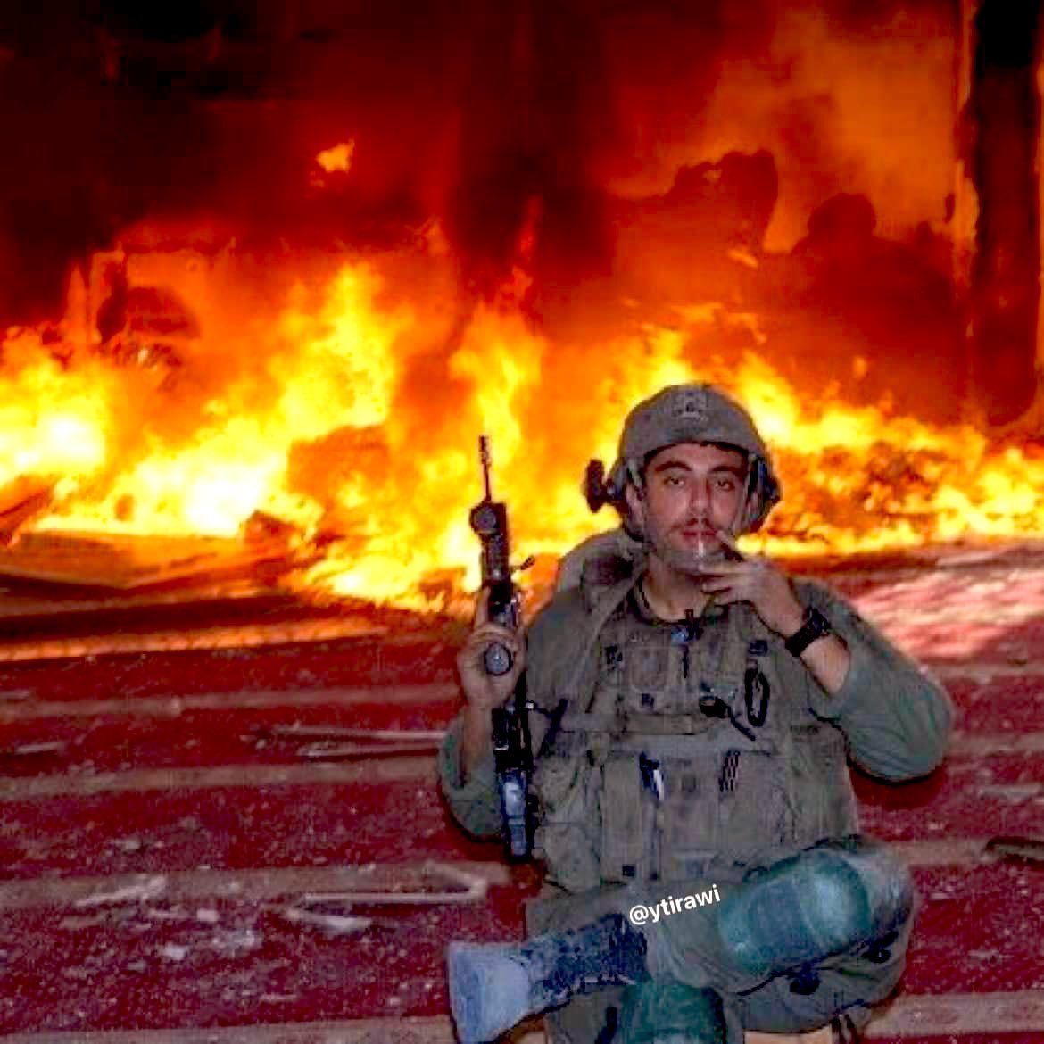 Israeli soldier poses after setting mosque ablaze in Rafah