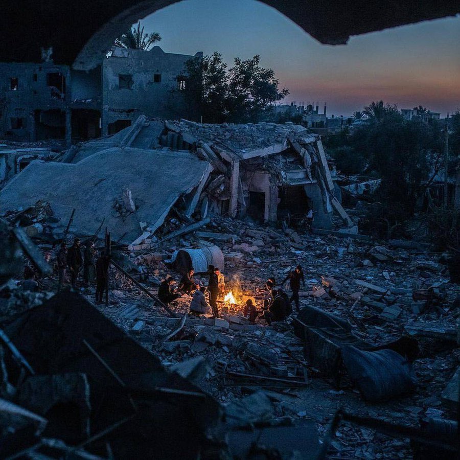 Palestinians amid ruins after Israeli airstrikes in Khan Younis