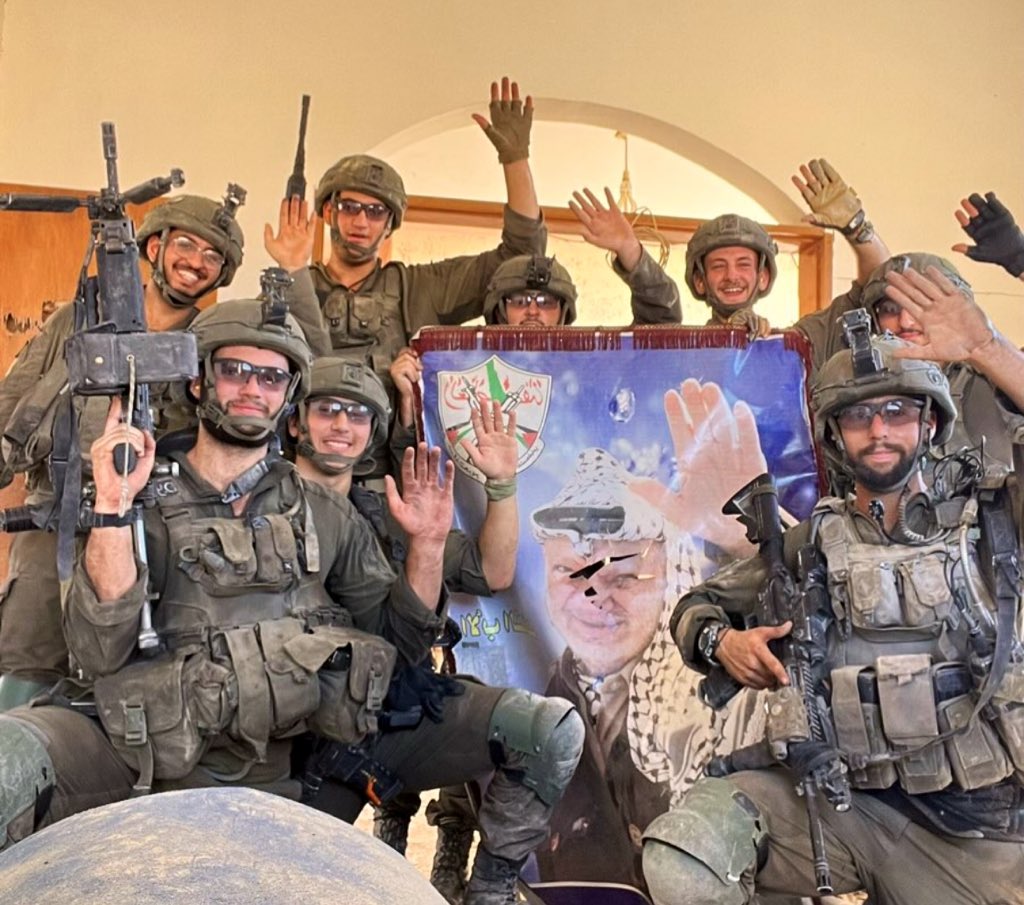 IOF soldiers mock Yasser Arafat with poster photo in Gaza