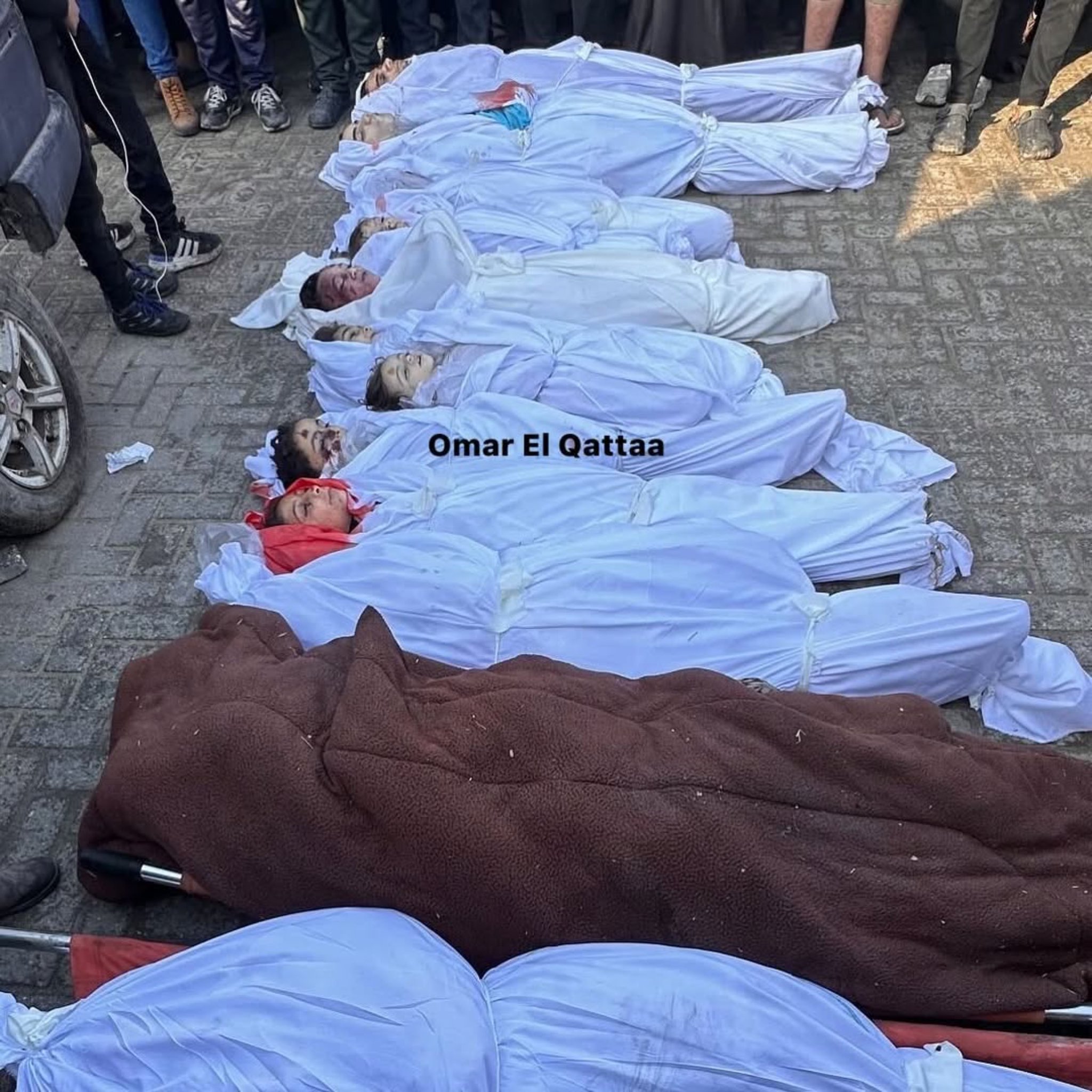 13 Palestinian civilians laid to rest in Gaza airstrikes