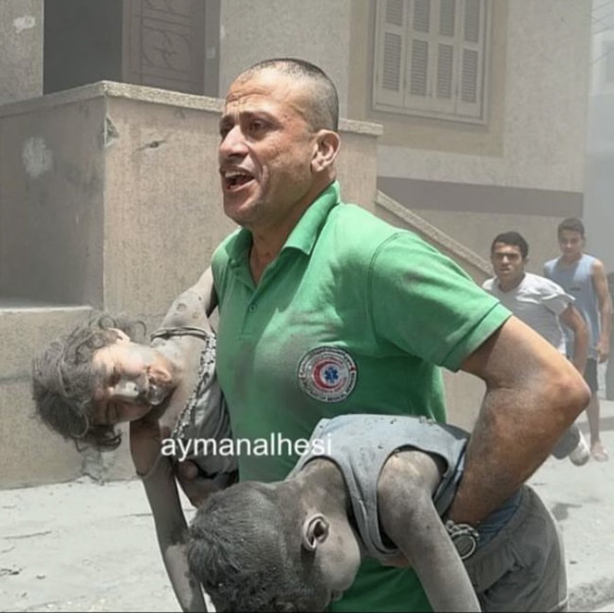 Paramedic carries children’s bodies after Gaza camp bombing