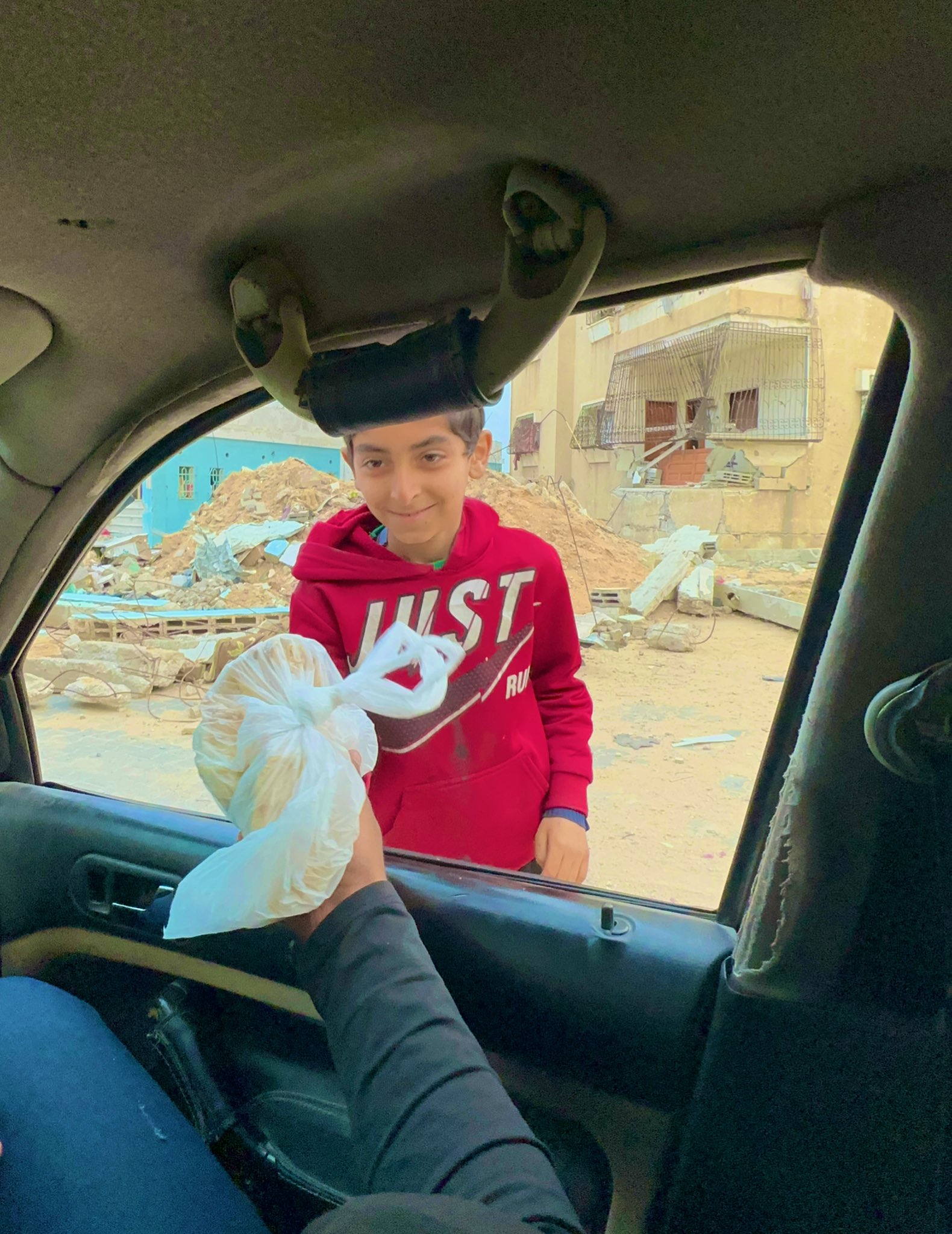 Creating smiles through simple bread distribution acts