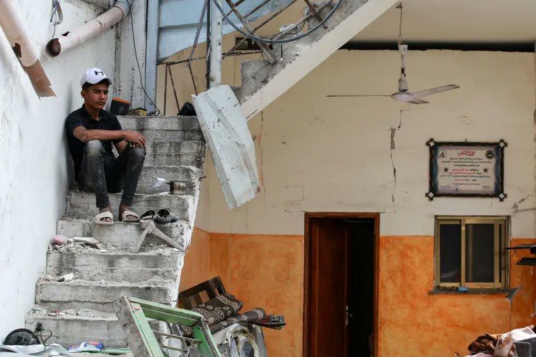 Palestinians collect remains after Israeli airstrike destroys Nuseirat building