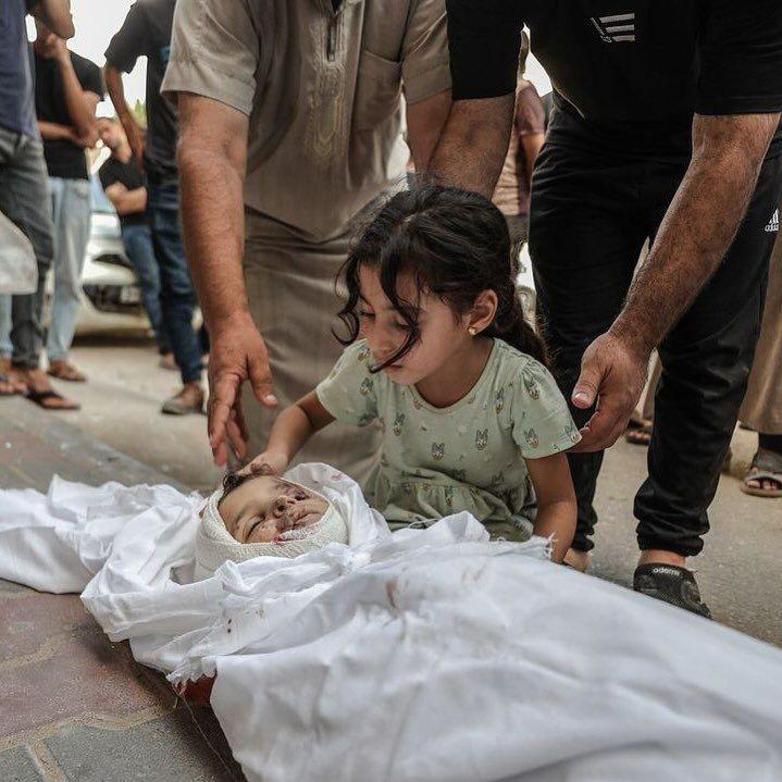 Palestinian girl says goodbye to child killed in Israeli airstrike