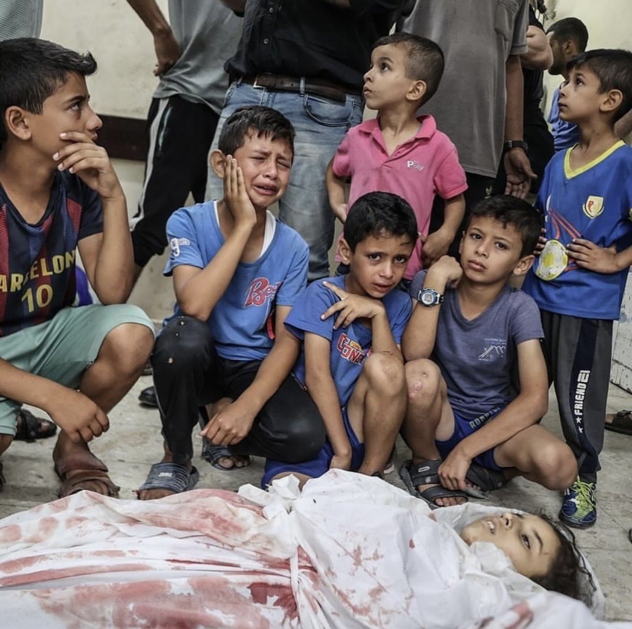 Palestinian children mourn girl killed in Gaza airstrike