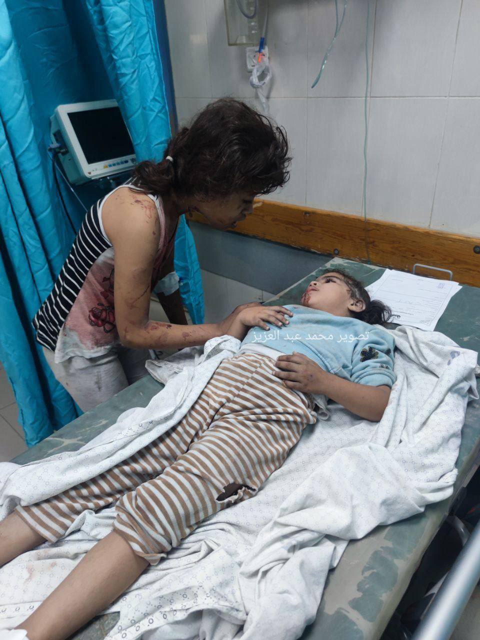 Gaza children check on each other after deadly air strikes