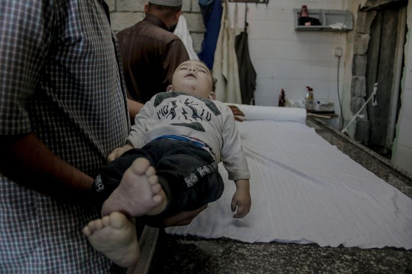 Palestinian relatives mourn child killed by Israeli airstrike in Gaza