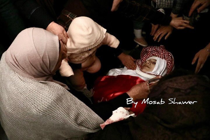 Baby girl bids farewell to mother killed in Hebron raid