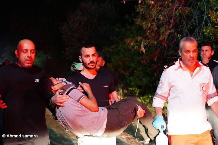 Israeli settlers attack Bruqin, injure Palestinians, burn homes
