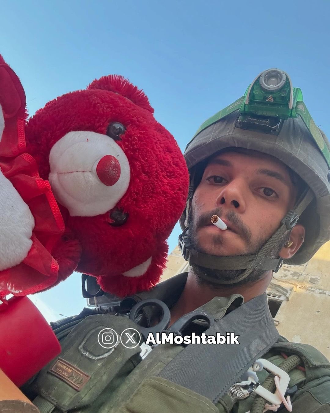 Israeli soldiers take selfies with Palestinian children’s toys in Rafah