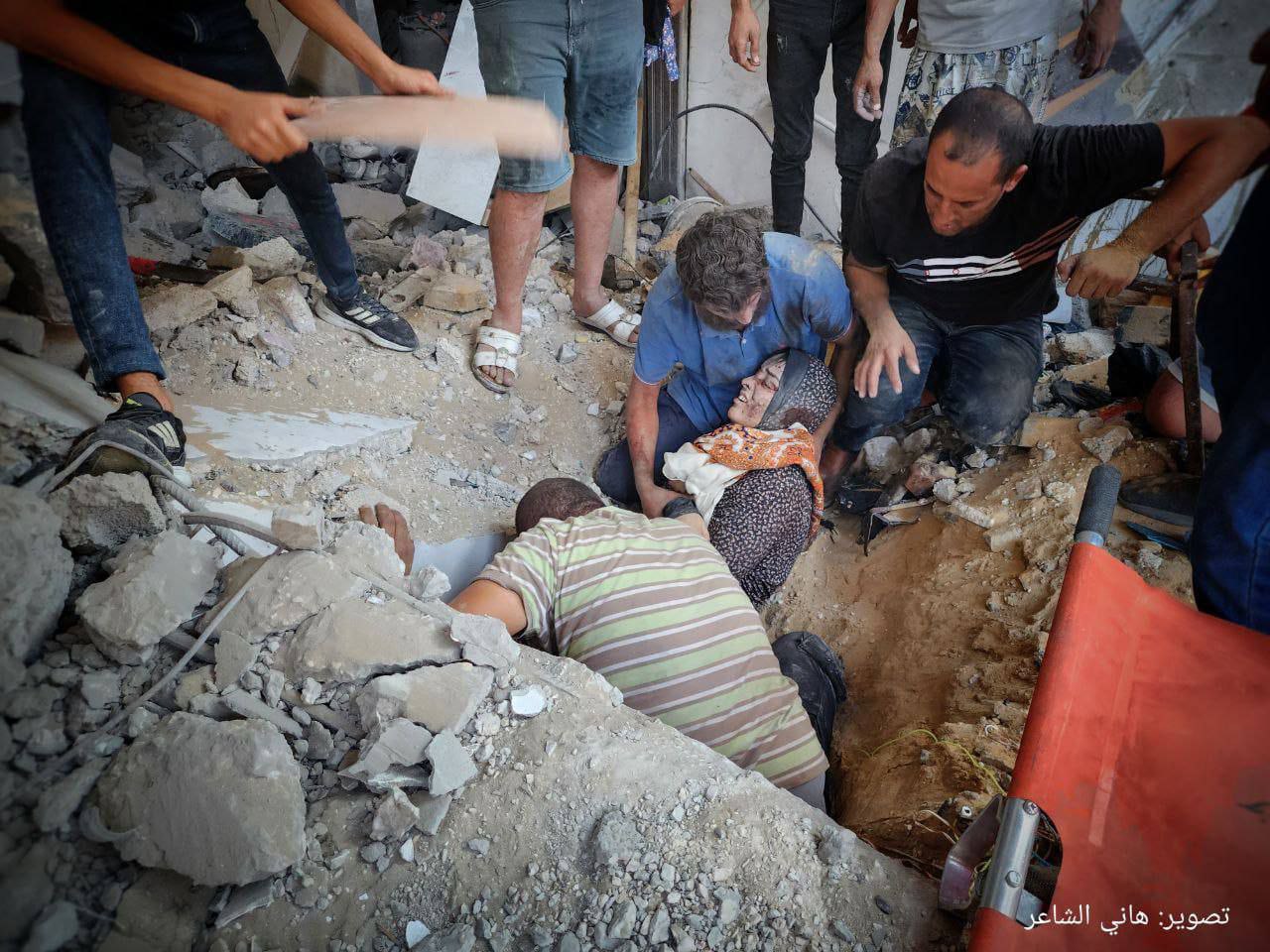 Palestinian Woman Rescued from Bombed House in Rafah