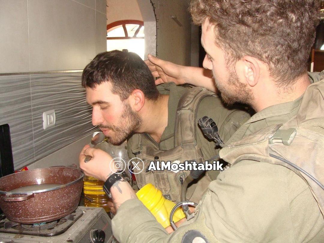 IOF soldiers occupying Palestinian homes then burning them down