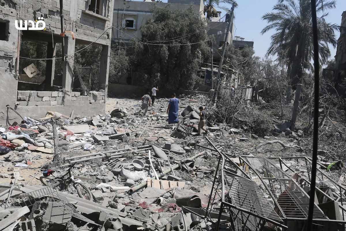 Palestinians inspect rubble of bombed Abu Fraih family house in Gaza