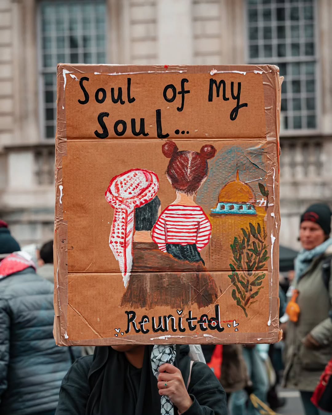 Solidarity Protest Banner Honors Khaled Nabhan and Granddaughter Reem