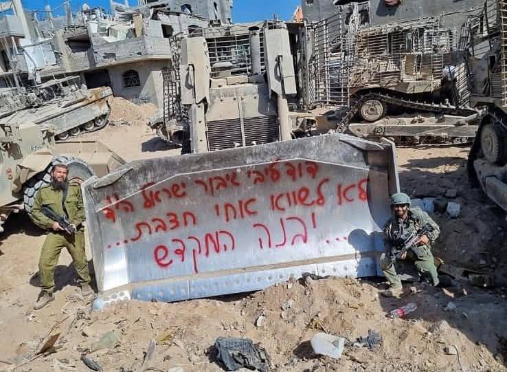 Israeli soldiers write religious slogans on bulldozers demolishing Gaza homes