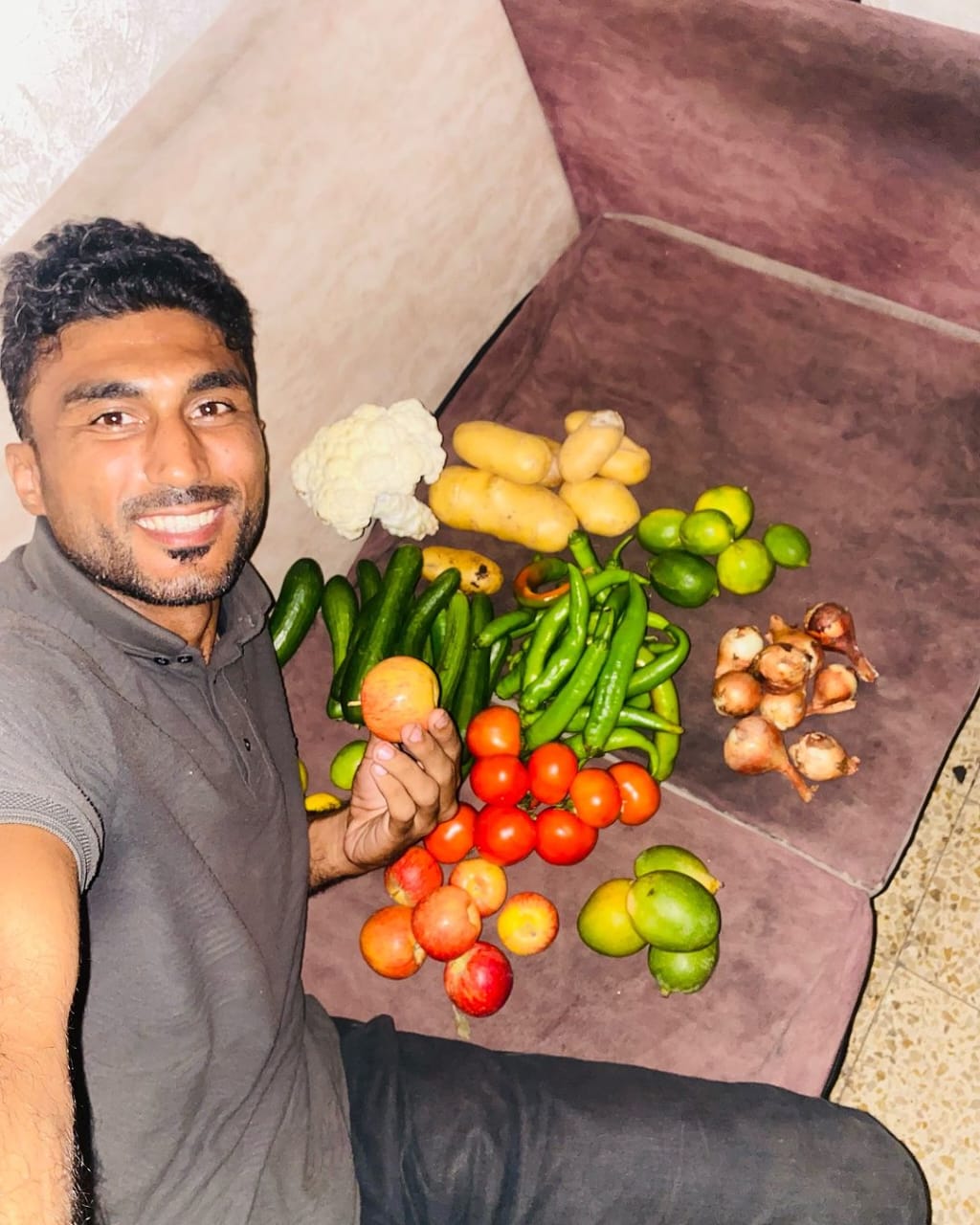 Palestinian man celebrates vegetable purchase after Gaza shortage