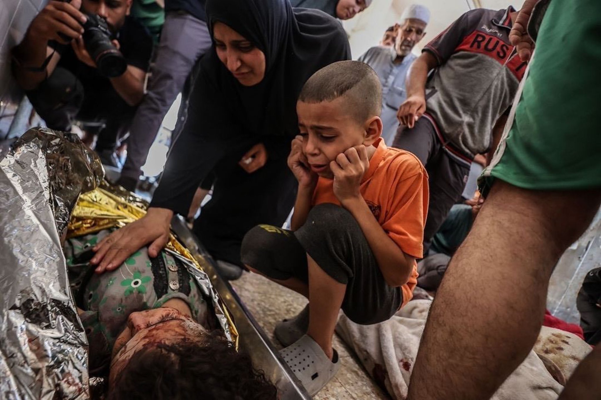 Child grieves sister killed in Gaza refugee camp attack