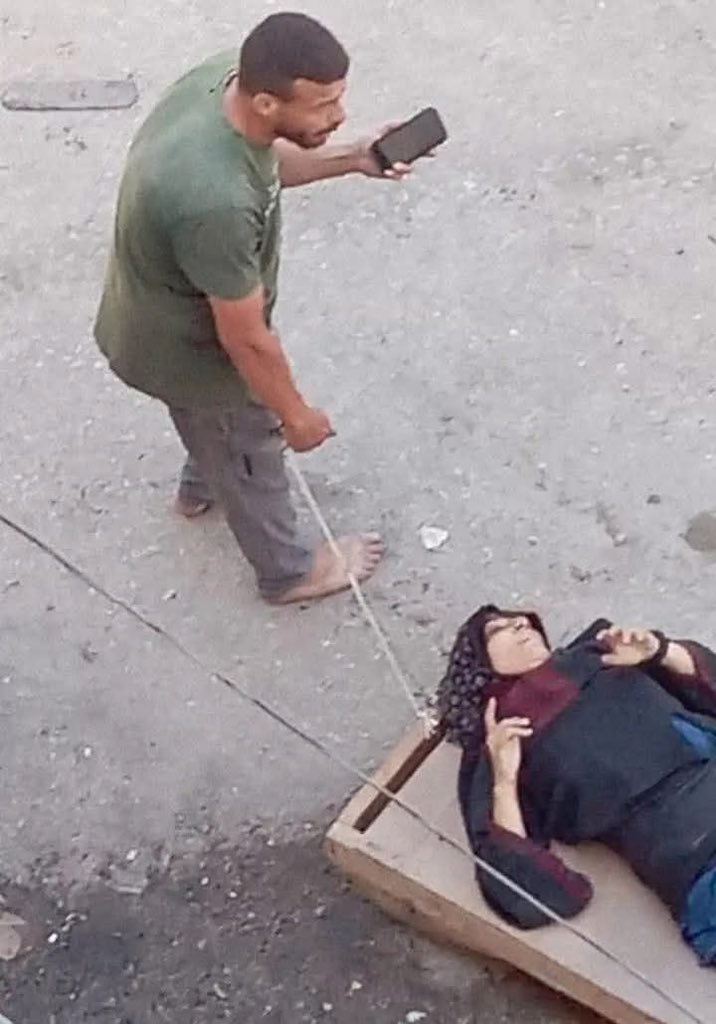Palestinian man rescues wounded mother from Israeli bombing